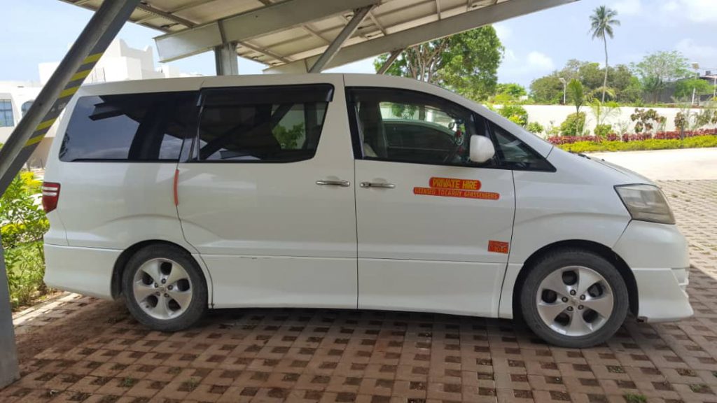 travelers get taxi to nungwi